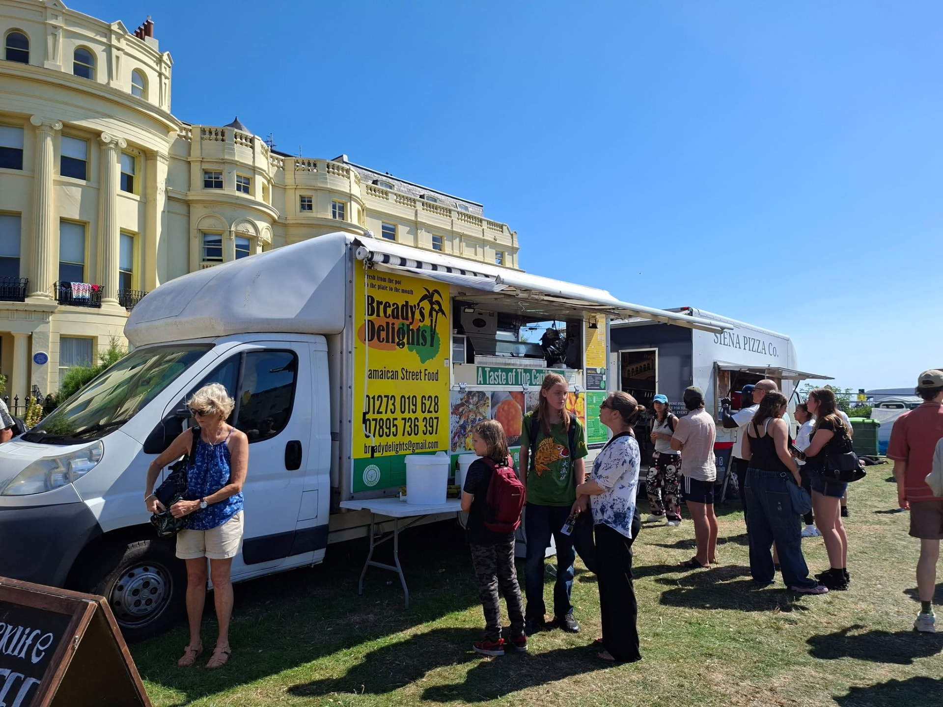 Customers queuing at the Bready's Delights Jamaican street food van